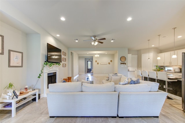3502 Harper Ferry Pl, Katy, TX 77494 - living area with ceiling fan, recessed lighting, and a fireplace