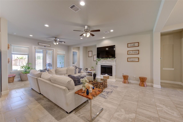 3502 Harper Ferry Pl, Katy, TX 77494 - living room with recessed lighting, a fireplace, a ceiling fan, and light tile patterned floors