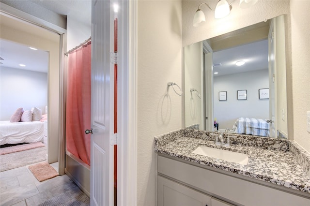 3502 Harper Ferry Pl, Katy, TX 77494 - ensuite bathroom featuring vanity, shower / bath combination with curtain, and a textured wall