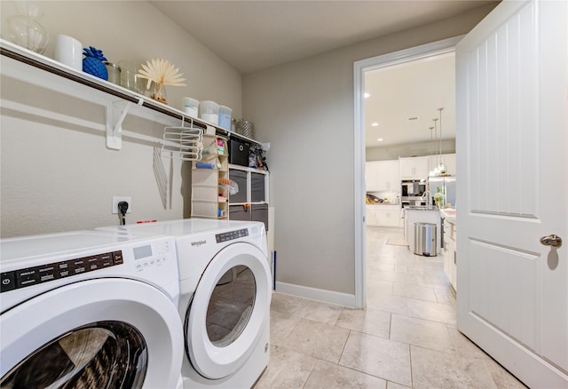 3502 Harper Ferry Pl, Katy, TX 77494 - laundry room featuring washing machine and dryer and light tile patterned floors
