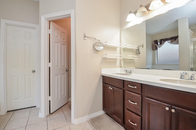 8711 Chamomile Meadow Trl, Katy, TX 77494 - bathroom with double vanity and tile patterned flooring