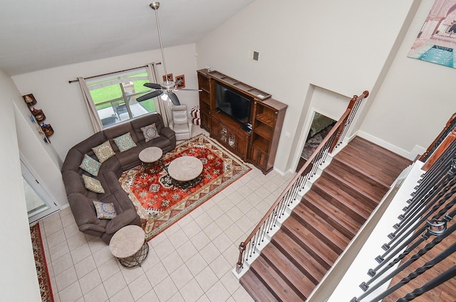 8711 Chamomile Meadow Trl, Katy, TX 77494 - living area with lofted ceiling, tile patterned flooring, and ceiling fan