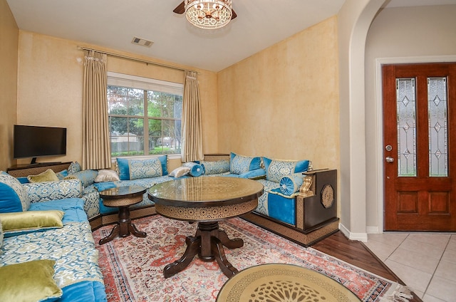 8711 Chamomile Meadow Trl, Katy, TX 77494 - living area featuring arched walkways and tile patterned flooring