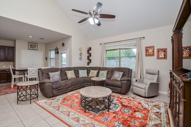 8711 Chamomile Meadow Trl, Katy, TX 77494 - living area featuring light tile patterned flooring, a ceiling fan, and high vaulted ceiling
