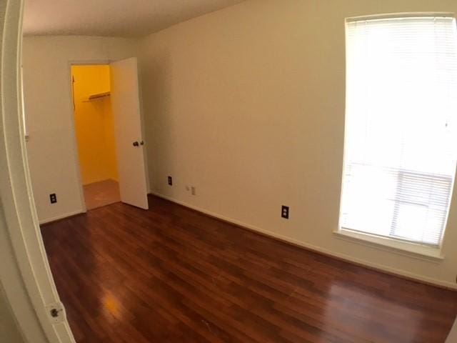 9001 Imogene St Unit A, Houston, TX 77036 - empty room featuring dark wood finished floors and baseboards