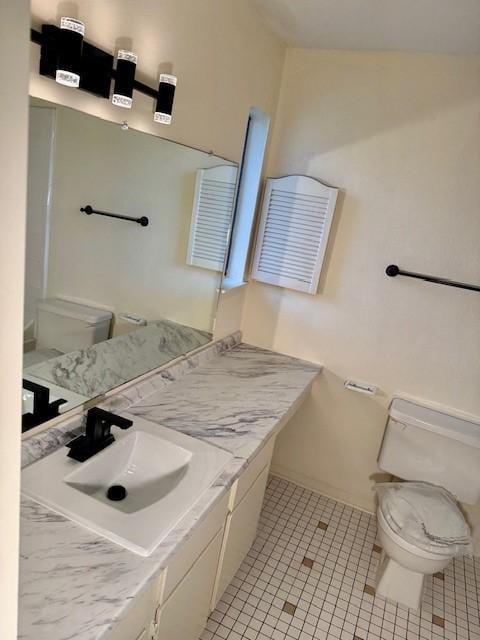 9001 Imogene St Unit A, Houston, TX 77036 - bathroom with tile patterned flooring, vanity, and lofted ceiling
