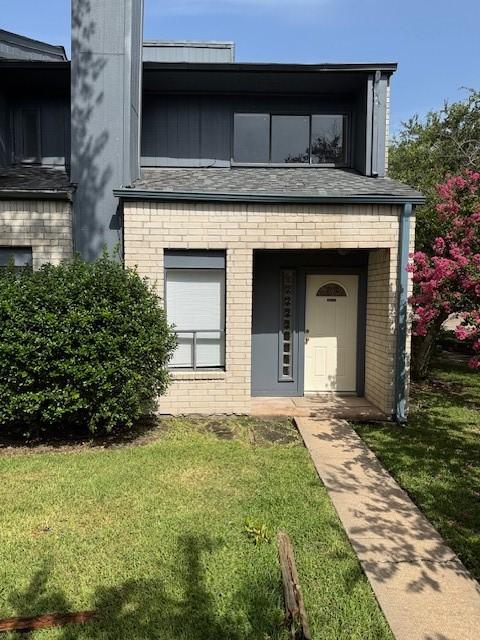 9001 Imogene St Unit A, Houston, TX 77036 - view of front of property with brick siding and a front lawn