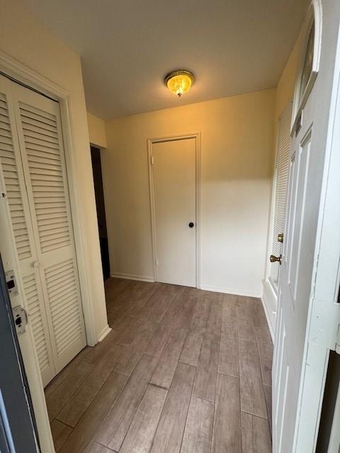 9001 Imogene St Unit A, Houston, TX 77036 - corridor featuring wood finished floors and baseboards