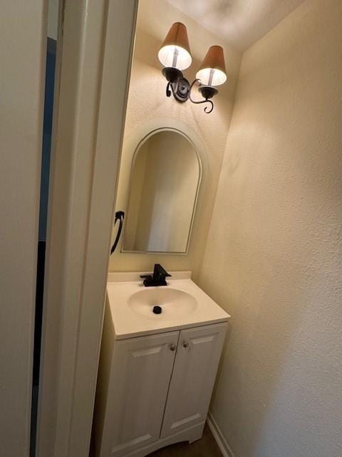 9001 Imogene St Unit A, Houston, TX 77036 - bathroom featuring vanity and a textured wall