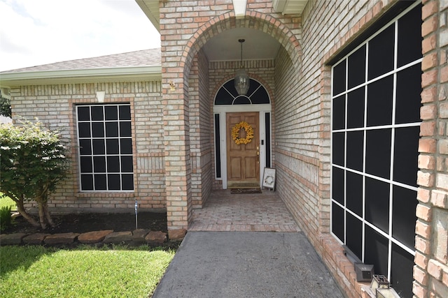 5113 Greenwater Dr, Willis, TX 77318 - property entrance featuring brick siding and a shingled roof