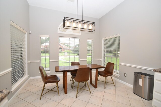 5113 Greenwater Dr, Willis, TX 77318 - dining area featuring a high ceiling and light tile patterned floors