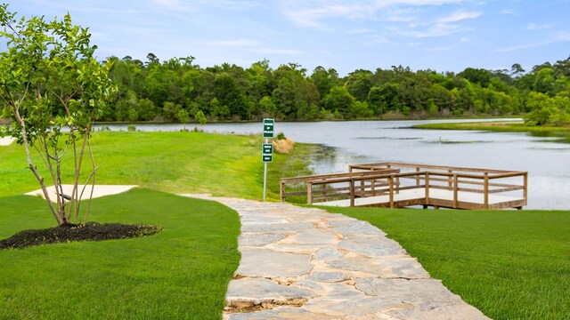 42615 Mystery Ln, Magnolia, TX 77354 - dock area featuring a water view, a lawn, and a wooded view