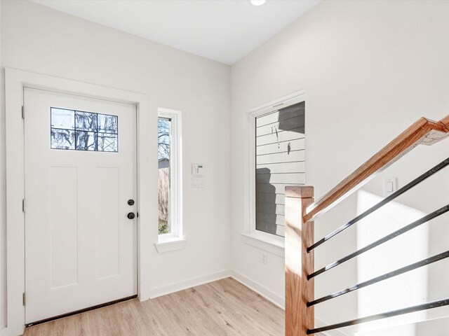 5702 Elysian St, Houston, TX 77009 - entryway featuring light wood finished floors and stairway