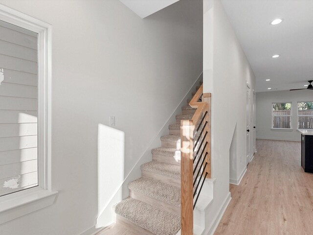 5702 Elysian St, Houston, TX 77009 - stairs featuring recessed lighting, wood finished floors, and a ceiling fan