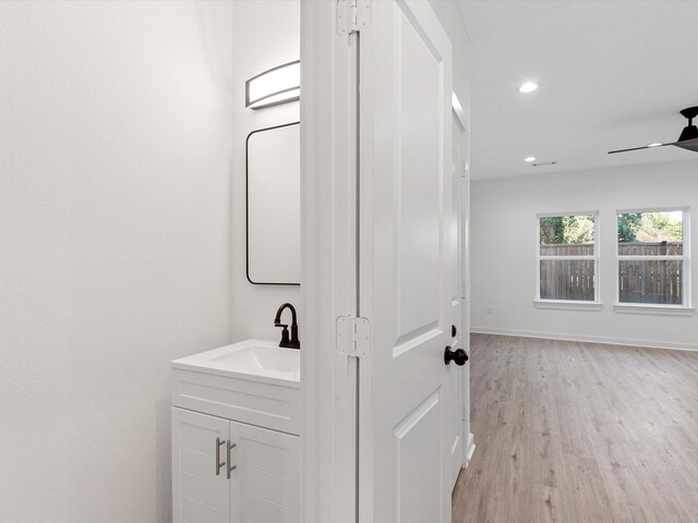 5702 Elysian St, Houston, TX 77009 - bathroom with vanity, wood finished floors, ceiling fan, and recessed lighting
