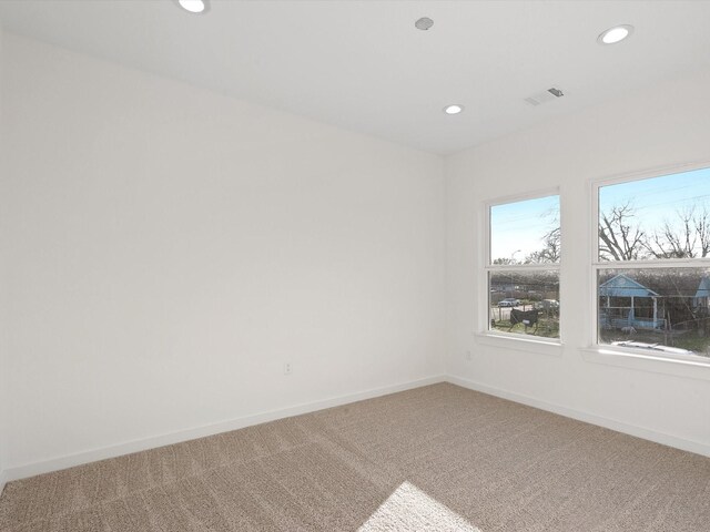5702 Elysian St, Houston, TX 77009 - carpeted empty room with recessed lighting and baseboards