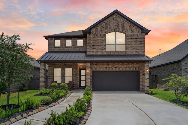 1919 Waters Branch Dr, Missouri City, TX 77459 - view of front of home with a standing seam roof, brick siding, and an attached garage