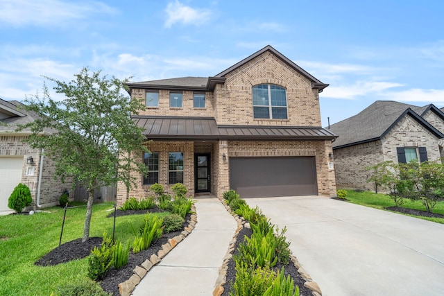 1919 Waters Branch Dr, Missouri City, TX 77459 - view of front of property with brick siding, a standing seam roof, driveway, and a garage