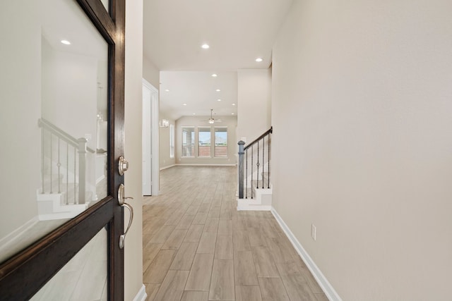 1919 Waters Branch Dr, Missouri City, TX 77459 - hallway featuring stairway, light wood-style floors, and recessed lighting