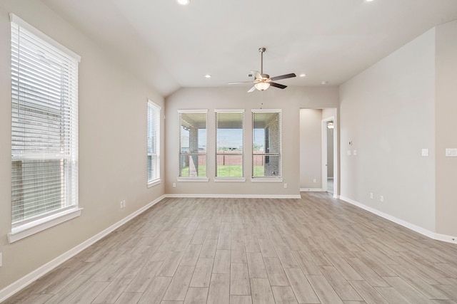 1919 Waters Branch Dr, Missouri City, TX 77459 - unfurnished living room featuring healthy amount of natural light, a ceiling fan, light wood finished floors, recessed lighting, and lofted ceiling