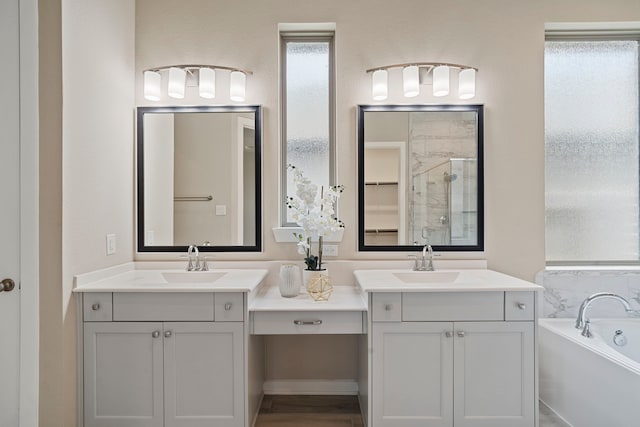 1919 Waters Branch Dr, Missouri City, TX 77459 - bathroom with vanity, a stall shower, and a garden tub