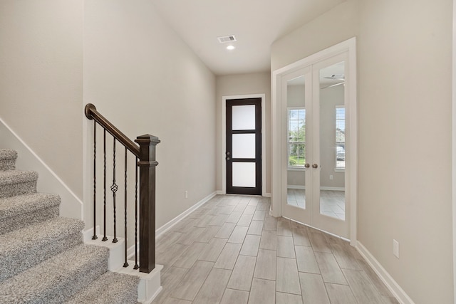 1919 Waters Branch Dr, Missouri City, TX 77459 - entrance foyer featuring stairs, recessed lighting, french doors, and light wood-style flooring