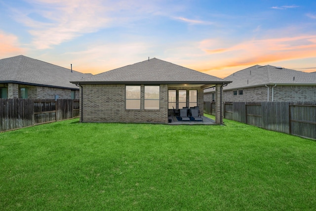 1919 Waters Branch Dr, Missouri City, TX 77459 - back of property featuring brick siding, a fenced backyard, and a patio area