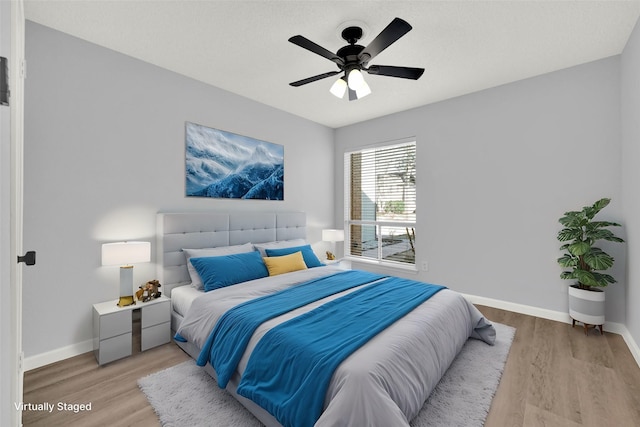 15810 Parksley Dr, Houston, TX 77059 - bedroom with light wood-type flooring and a ceiling fan
