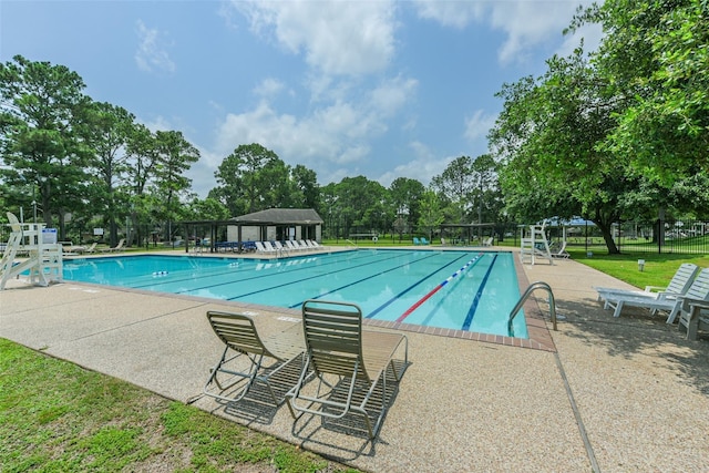 15810 Parksley Dr, Houston, TX 77059 - community pool featuring a patio and view of wooded area