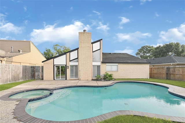 15810 Parksley Dr, Houston, TX 77059 - view of swimming pool with a fenced backyard, a patio, and a pool with connected hot tub