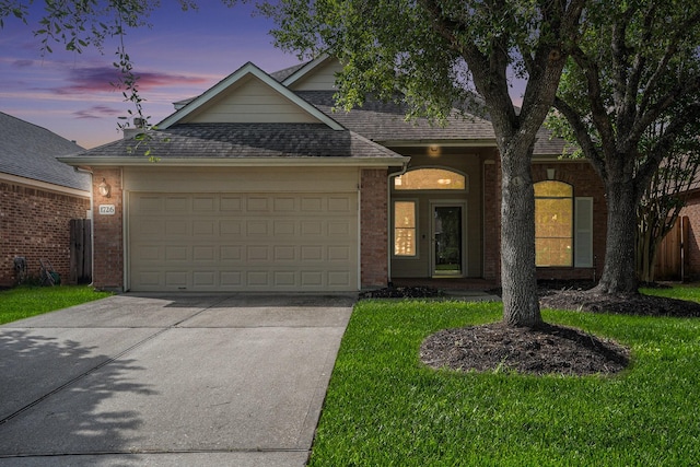 1726 Roaring Springs Ln, Seabrook, TX 77586 - view of front facade featuring concrete driveway, an attached garage, a shingled roof, brick siding, and a yard