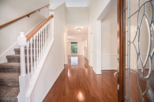 1726 Roaring Springs Ln, Seabrook, TX 77586 - entryway with wood finished floors and stairs