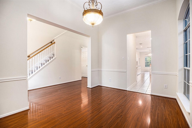 1726 Roaring Springs Ln, Seabrook, TX 77586 - unfurnished room featuring wood finished floors, stairs, and ornamental molding
