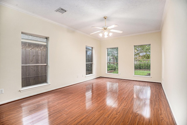 1726 Roaring Springs Ln, Seabrook, TX 77586 - spare room featuring wood finished floors, ceiling fan, crown molding, and a textured ceiling