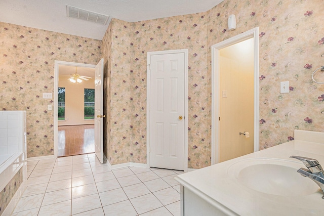 1726 Roaring Springs Ln, Seabrook, TX 77586 - bathroom with tile patterned flooring, vanity, and wallpapered walls