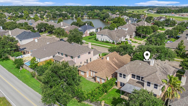 1726 Roaring Springs Ln, Seabrook, TX 77586 - aerial perspective of suburban area with a large body of water