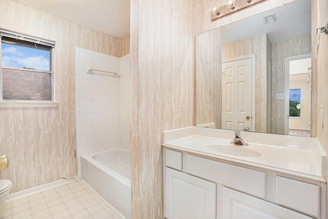 1726 Roaring Springs Ln, Seabrook, TX 77586 - full bathroom with vanity, bathing tub / shower combination, and a textured ceiling