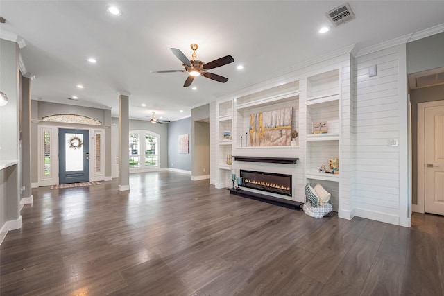 1013 Azalea Pointe, League City, TX 77573 - living area with ceiling fan, ornamental molding, a glass covered fireplace, recessed lighting, and dark wood-style floors