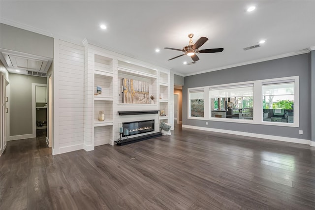 1013 Azalea Pointe, League City, TX 77573 - unfurnished living room with attic access, ceiling fan, a glass covered fireplace, crown molding, and dark wood-style floors