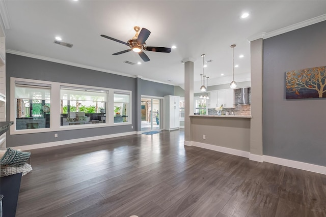 1013 Azalea Pointe, League City, TX 77573 - unfurnished living room featuring a ceiling fan, dark wood finished floors, crown molding, and recessed lighting