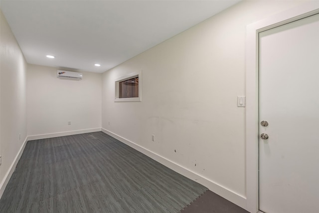 1013 Azalea Pointe, League City, TX 77573 - spare room featuring a wall mounted AC, dark wood-style floors, and recessed lighting