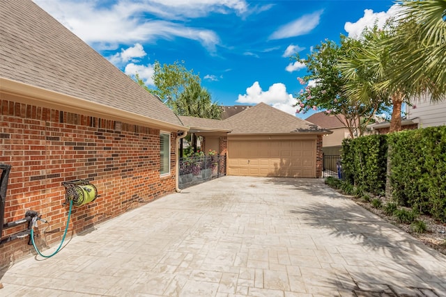 1013 Azalea Pointe, League City, TX 77573 - view of front of house with brick siding, a shingled roof, driveway, and a garage