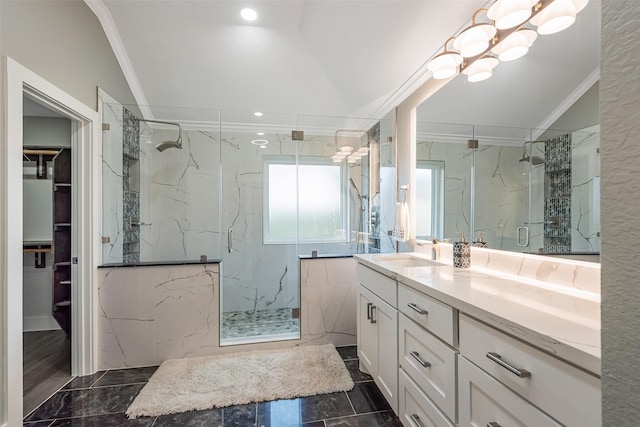 1013 Azalea Pointe, League City, TX 77573 - bathroom with crown molding, a marble finish shower, vanity, a spacious closet, and marble finish flooring