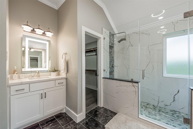 1013 Azalea Pointe, League City, TX 77573 - full bath featuring crown molding, marble look tile flooring, a marble finish shower, a walk in closet, and vanity