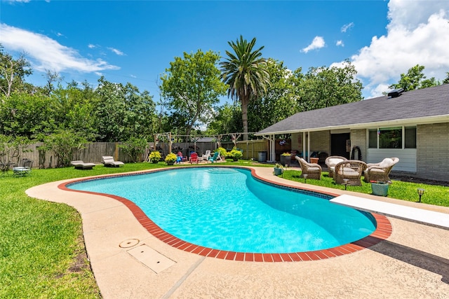 1208 15th Ave N, Texas City, TX 77590 - view of pool with a diving board, a fenced backyard, a patio, and an outdoor hangout area