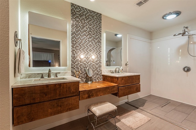 1208 15th Ave N, Texas City, TX 77590 - bathroom featuring tasteful backsplash, vanity, and a shower