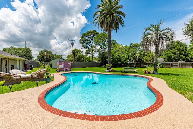 1208 15th Ave N, Texas City, TX 77590 - view of pool with a fenced backyard, an outdoor structure, and an outdoor hangout area
