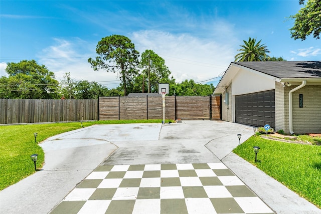 1208 15th Ave N, Texas City, TX 77590 - view of patio / terrace featuring driveway and a garage