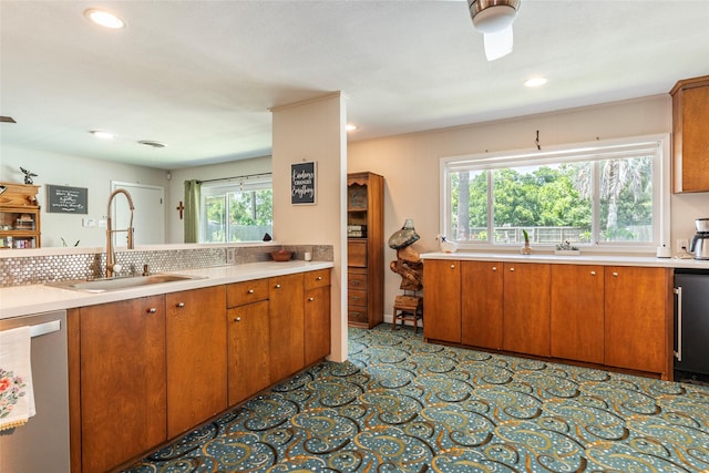 1208 15th Ave N, Texas City, TX 77590 - kitchen with dishwasher, light countertops, brown cabinets, and recessed lighting