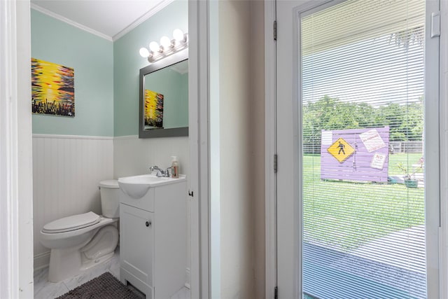 1208 15th Ave N, Texas City, TX 77590 - bathroom with vanity, ornamental molding, and wainscoting